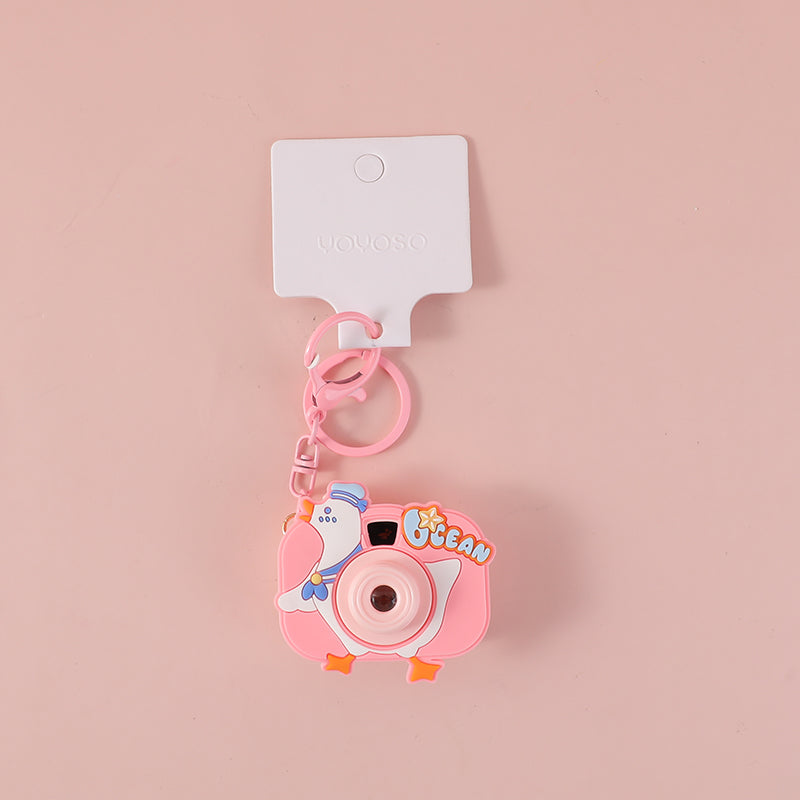 Videocamera da proiezione con portachiavi a cappello