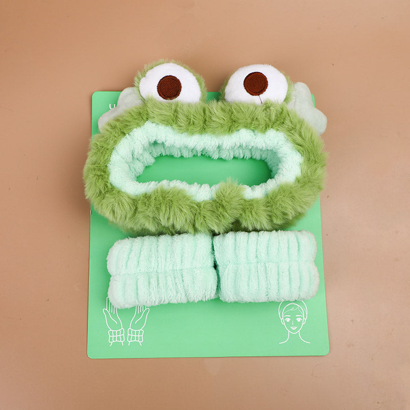 Set combinato di fascia per capelli e polsiere a forma di rana