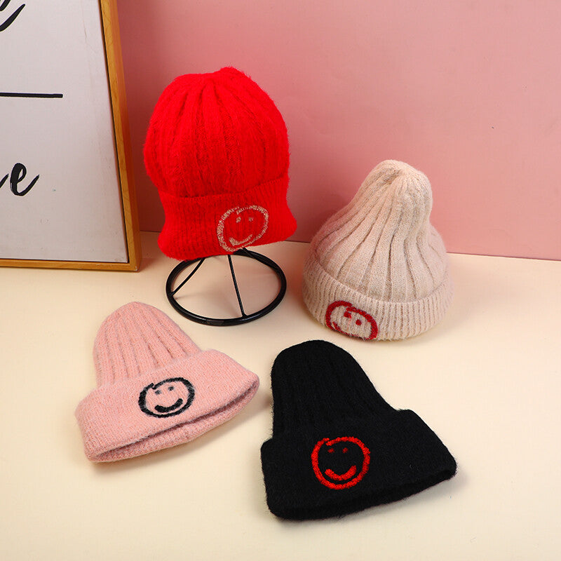 Cappello lavorato a maglia con faccina e risvolto