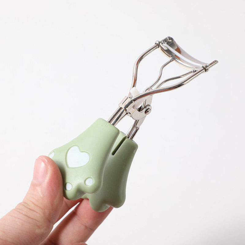 Arricciatore di ciglia a forma di artiglio per gatto confezionato in scatola