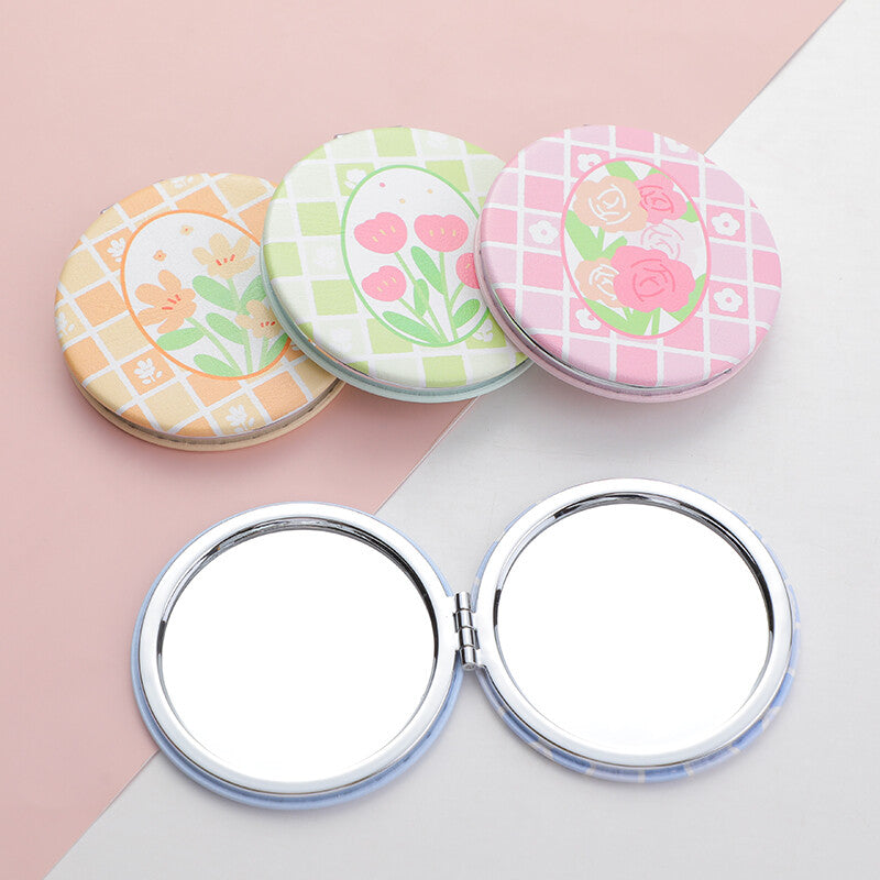 Specchio alla moda con serie romantica di fiori primaverili rotondi