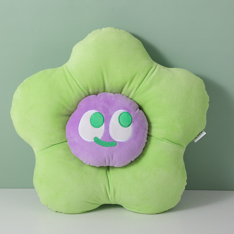 Cuscino a forma di fiore con faccina sorridente colorata, verde