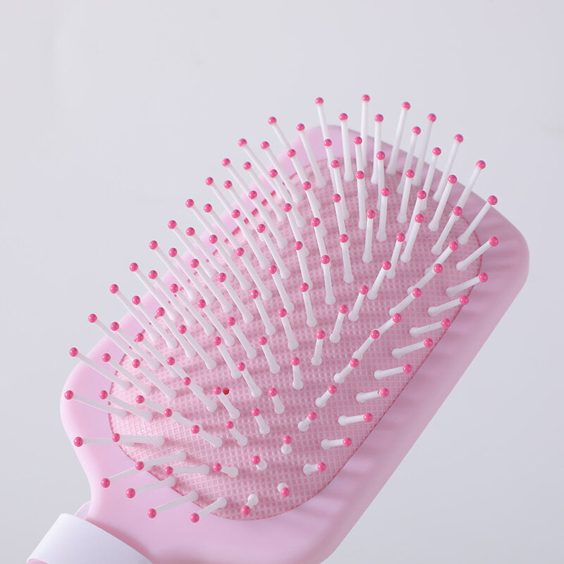 Pettine di massaggio a cuscino di formaggio - rosa