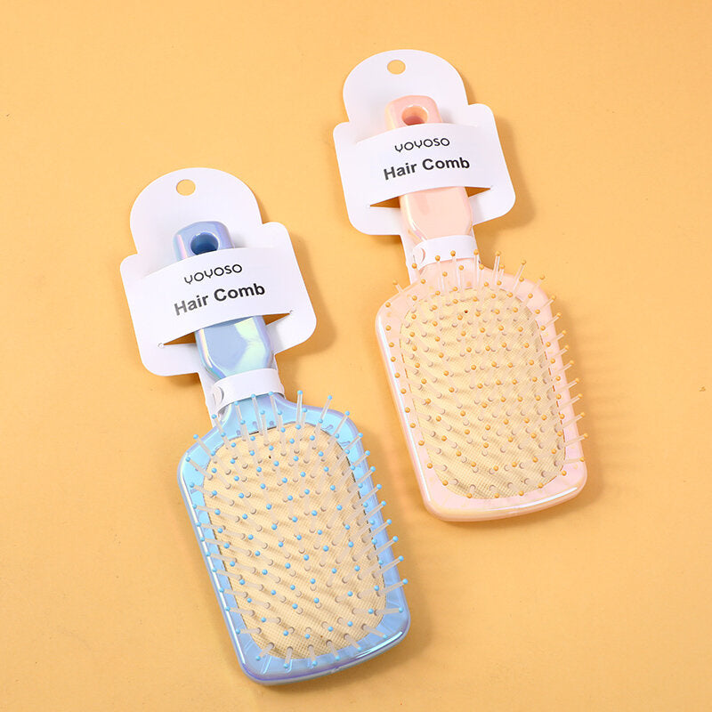 Pettine massaggiante a cuscino d'aria colorato