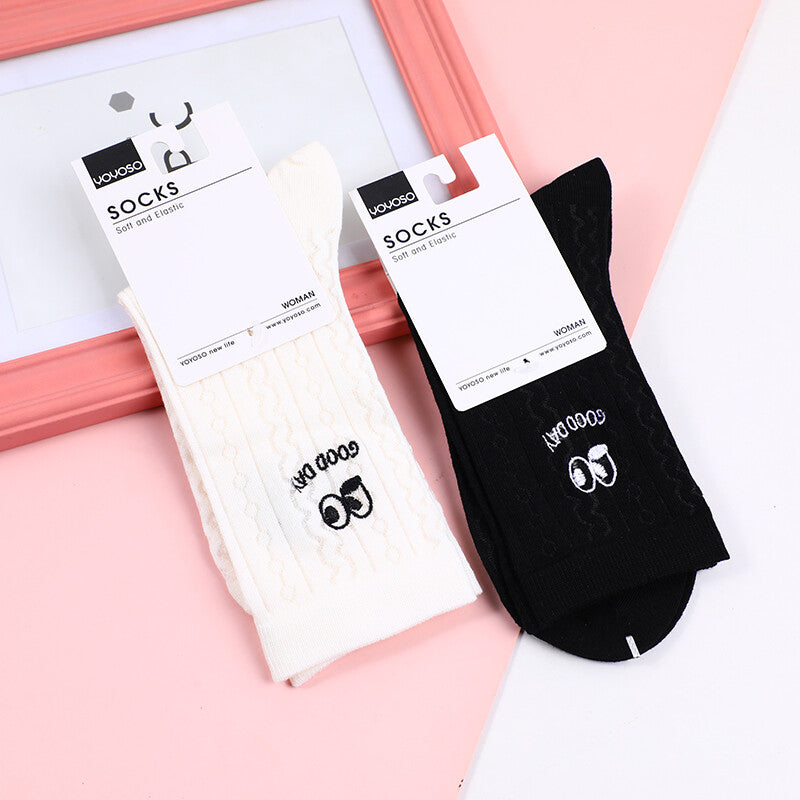 Calzini da donna a metà polpaccio con grandi occhi ricamati in bianco e nero