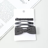 Fermaglio nero a forma di papillon 4 pz