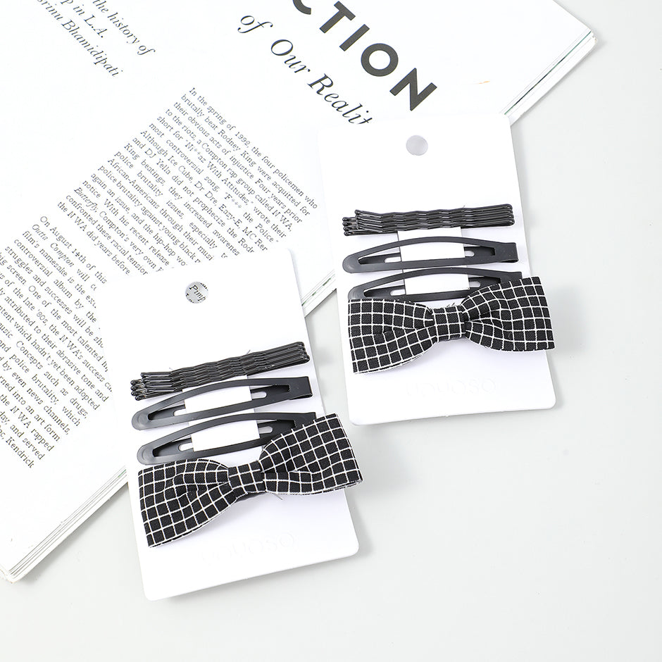 Fermaglio nero a forma di papillon 4 pz