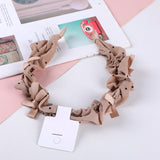 Cerchietto per capelli con nodo a fiocco a pois