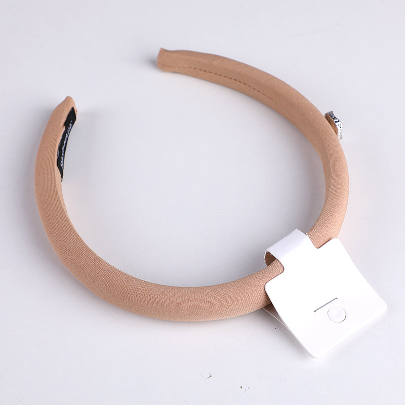 Cerchietto per capelli alta con teschio in tessuto monocromatico