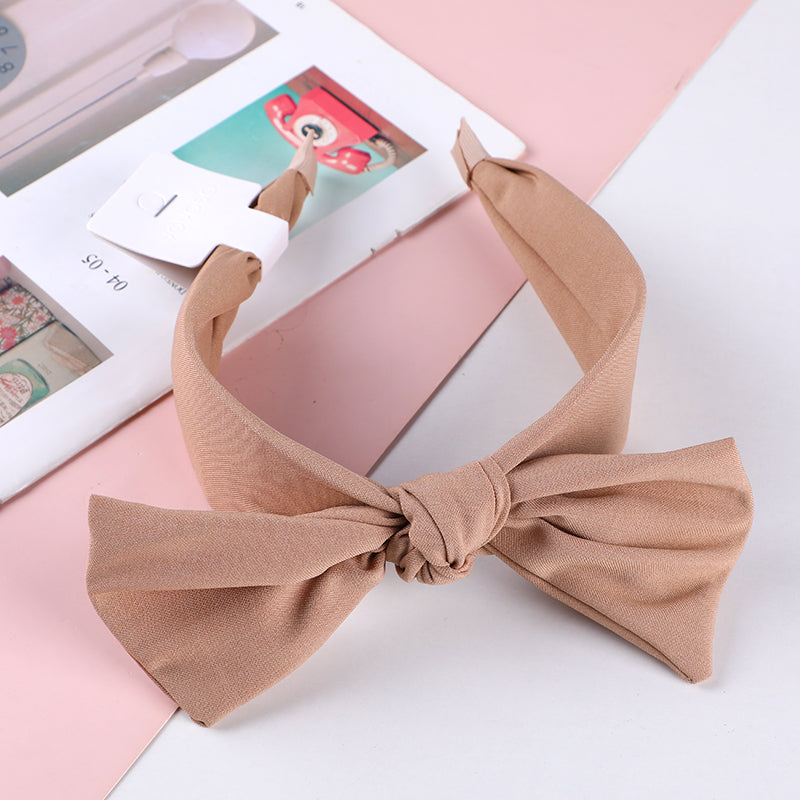 Cerchietto per capelli con orecchie in tessuto monocromatico