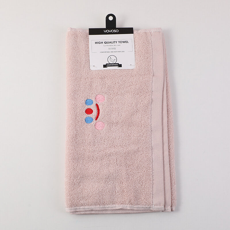 Asciugamano in puro cotone con ricamo del volto sorridente