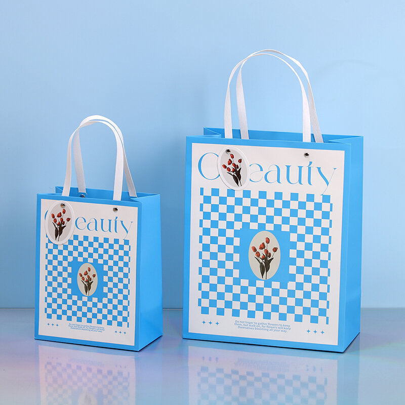 Busta regalo verticale con campanello a vento blu S