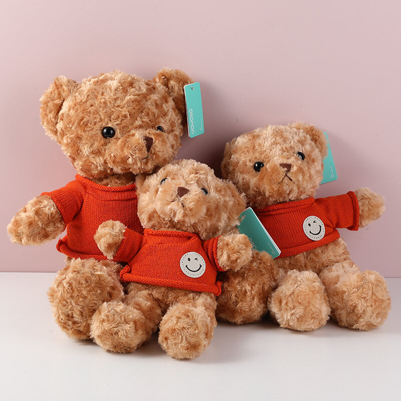 Piccola bambola orsetto marrone con maglione ce faccina sorridente,  - 35 cm (occhi di plastica)