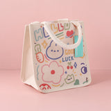 Trapezoid handbag with large green stripes