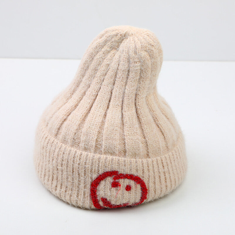 Cappello lavorato a maglia con faccina e risvolto