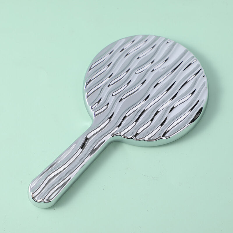 Specchio di bellezza rotondo ondulato con maniglia