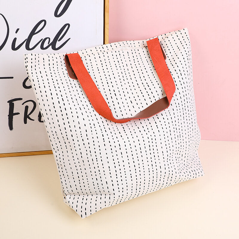 Semplice shopping bag geometrica con tracolla in pelle