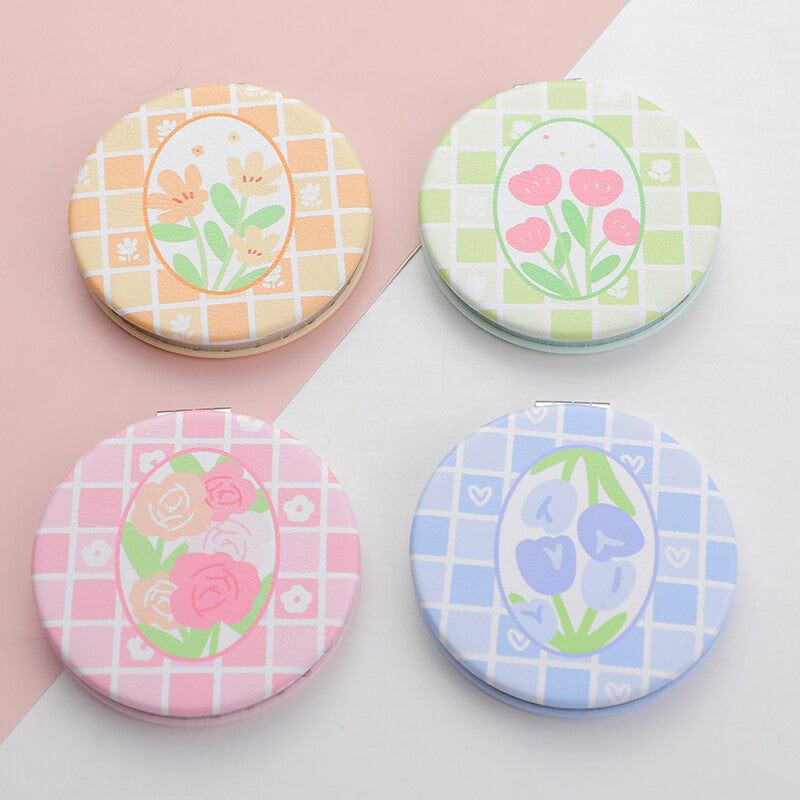 Specchio alla moda con serie romantica di fiori primaverili rotondi