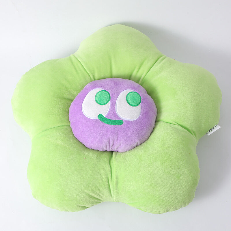 Cuscino a forma di fiore con faccina sorridente colorata, verde