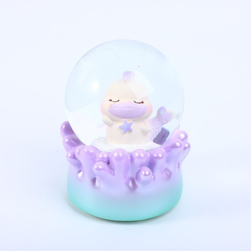 Globo di neve con luce che scuote la mano del mare di corallo #65