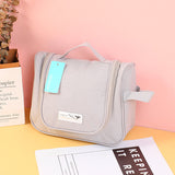 Borsa cosmetica portatile semplice ed elegante con gancio