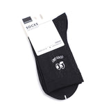 Calzini da donna a metà polpaccio con grandi occhi ricamati in bianco e nero