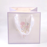 Borsa regalo a fondo largo con fiori della serie viola-L