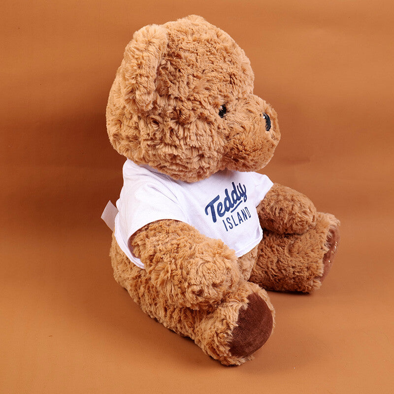 TEDDY ISLAND bambola di peluche orsetto seduto di colore scuro con maglietta blu-35 cm
