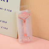 Massaggiatore a rulli in cristallo rosa con asta in acrilico