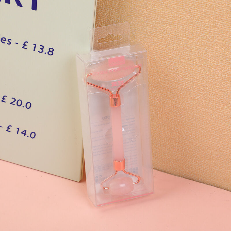 Massaggiatore a rulli in cristallo rosa con asta in acrilico