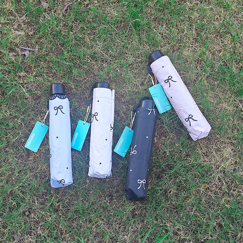 Ombrello pieghevole a tre ante con fiocco in pizzo